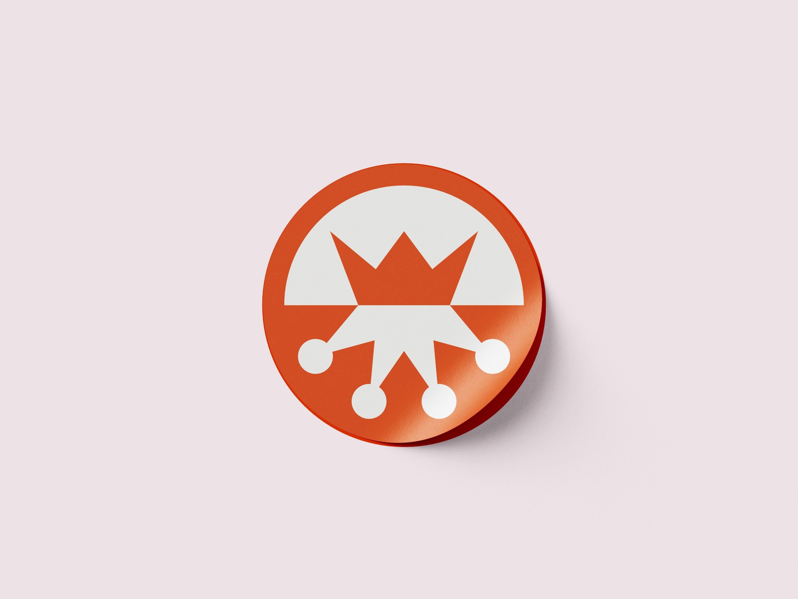 Orange sticker with the brand logomark