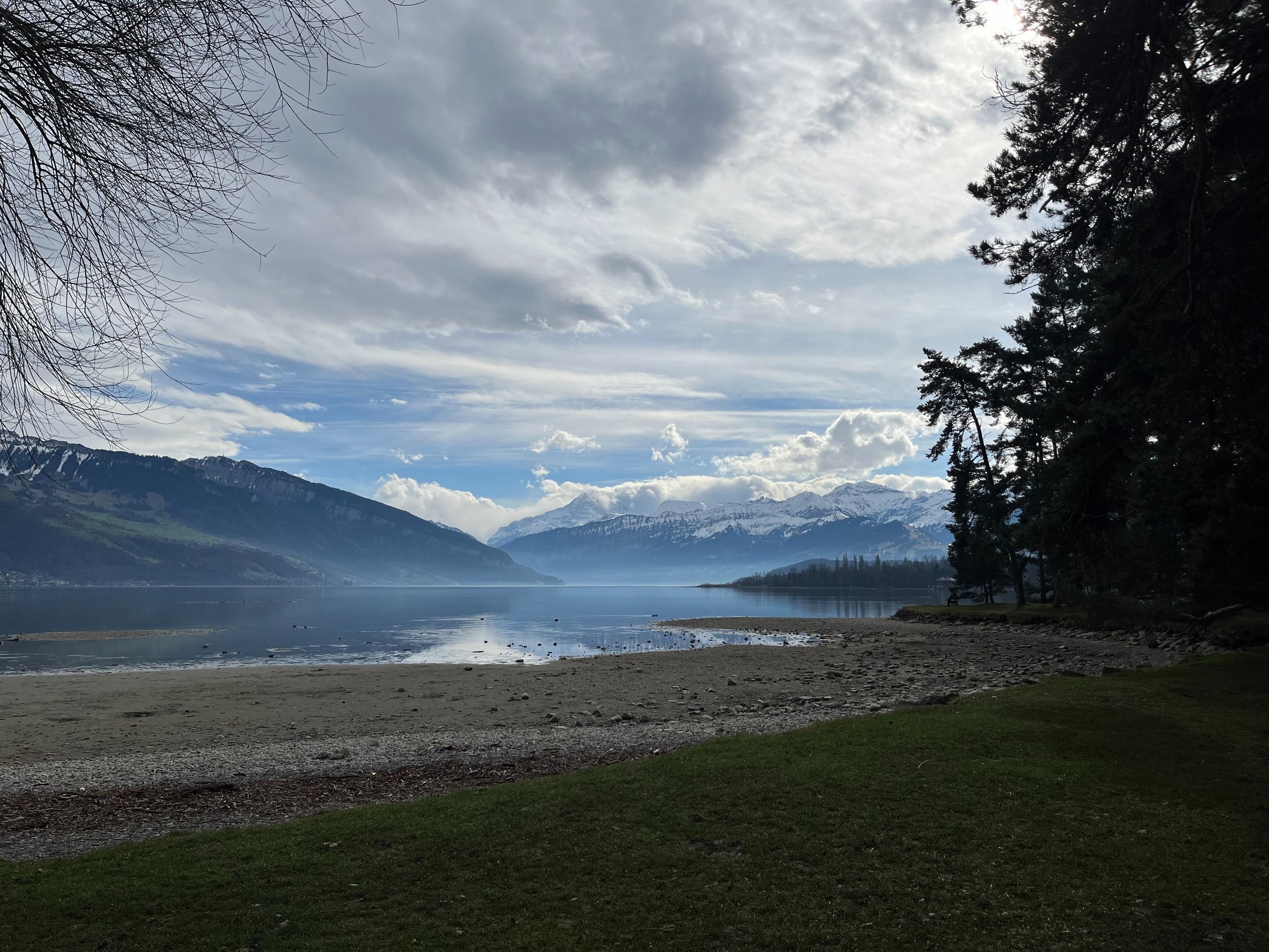 A view looking up Lake Thun from the beech in Thun Switzerland
