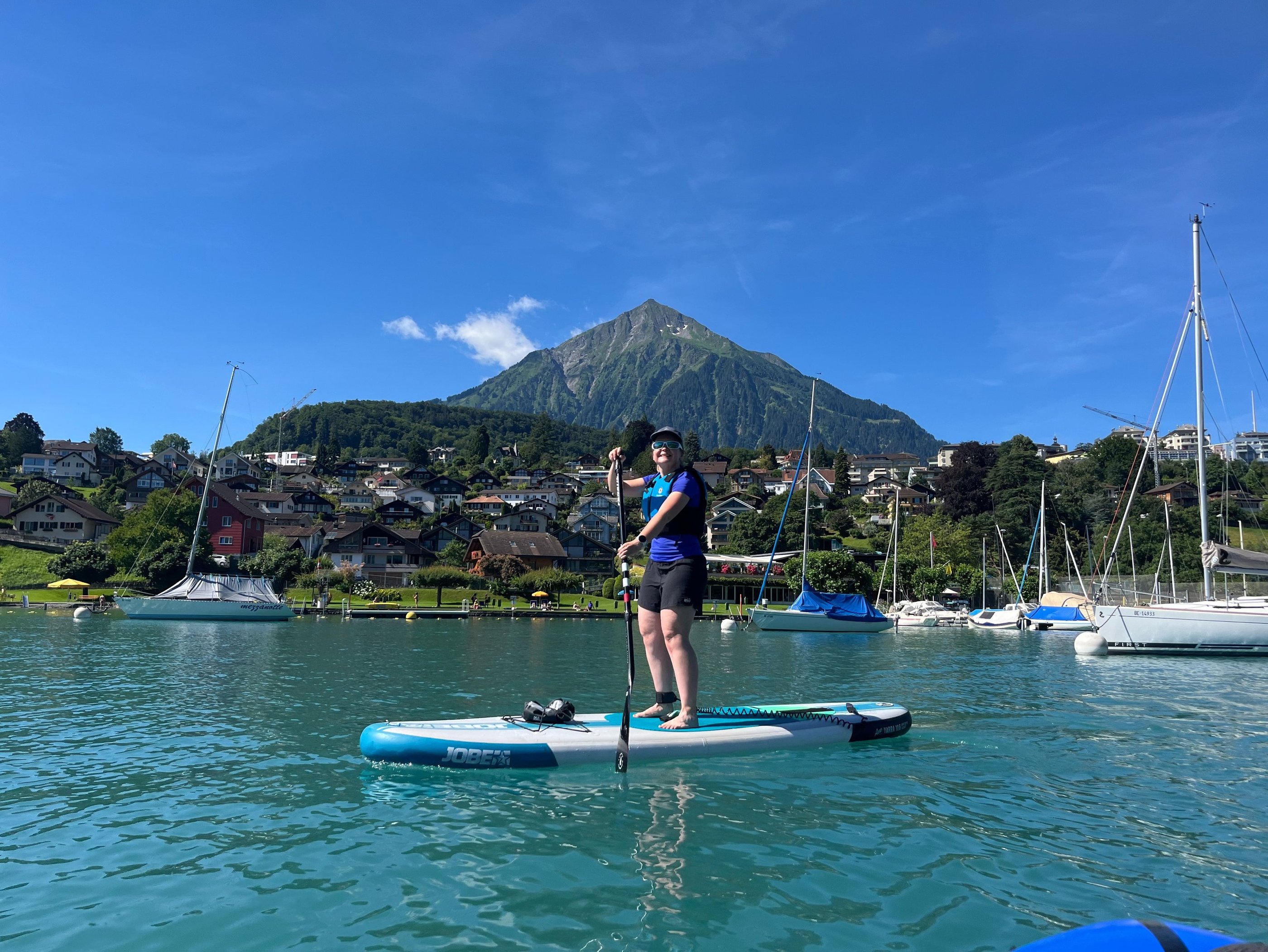 Corinne from Hidden Switzerland Travel Paddling in Spiez on the Western Side of Lake Thun