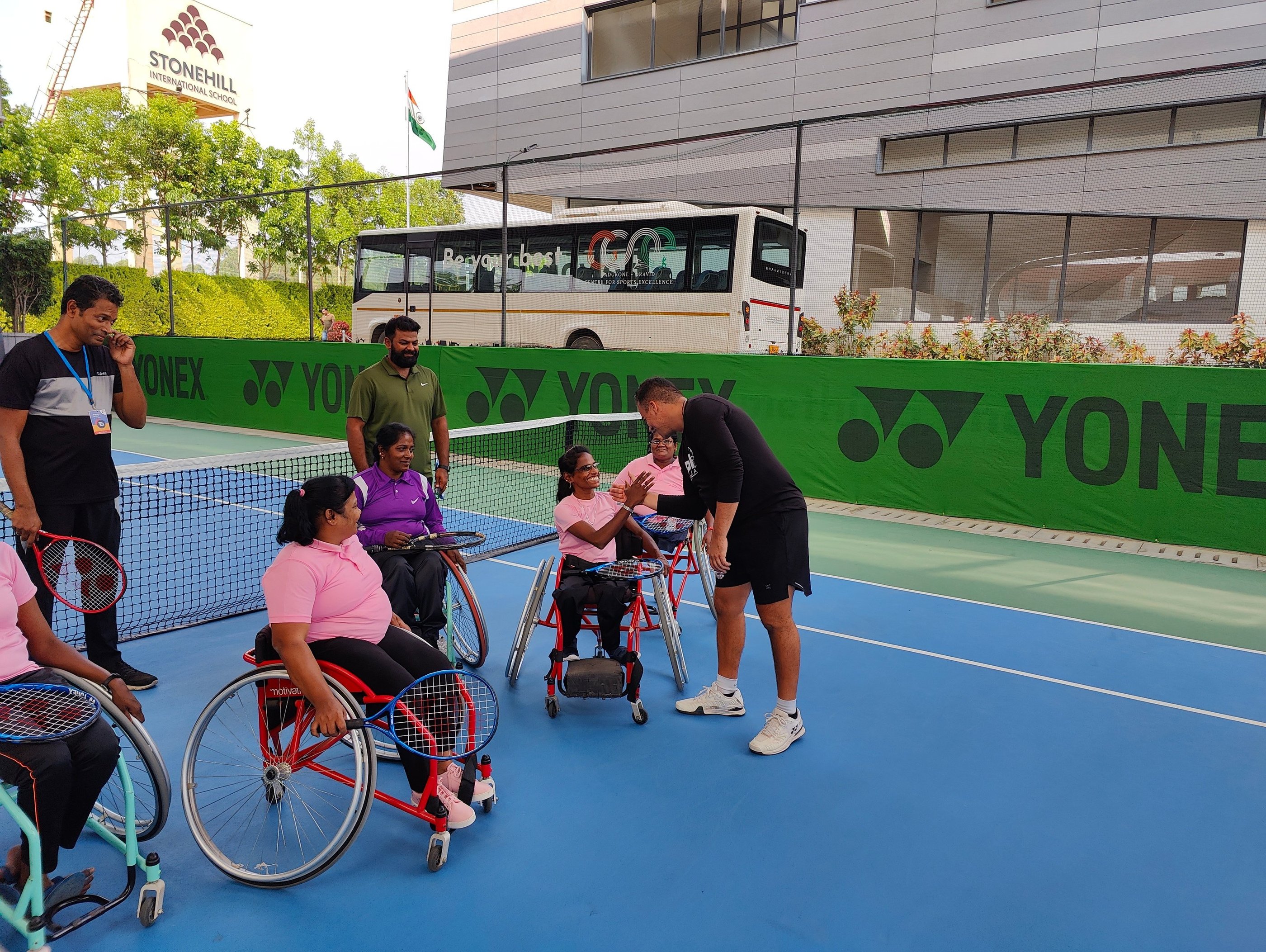 Wheelchair tennis women player working with Cesar Performance Coach