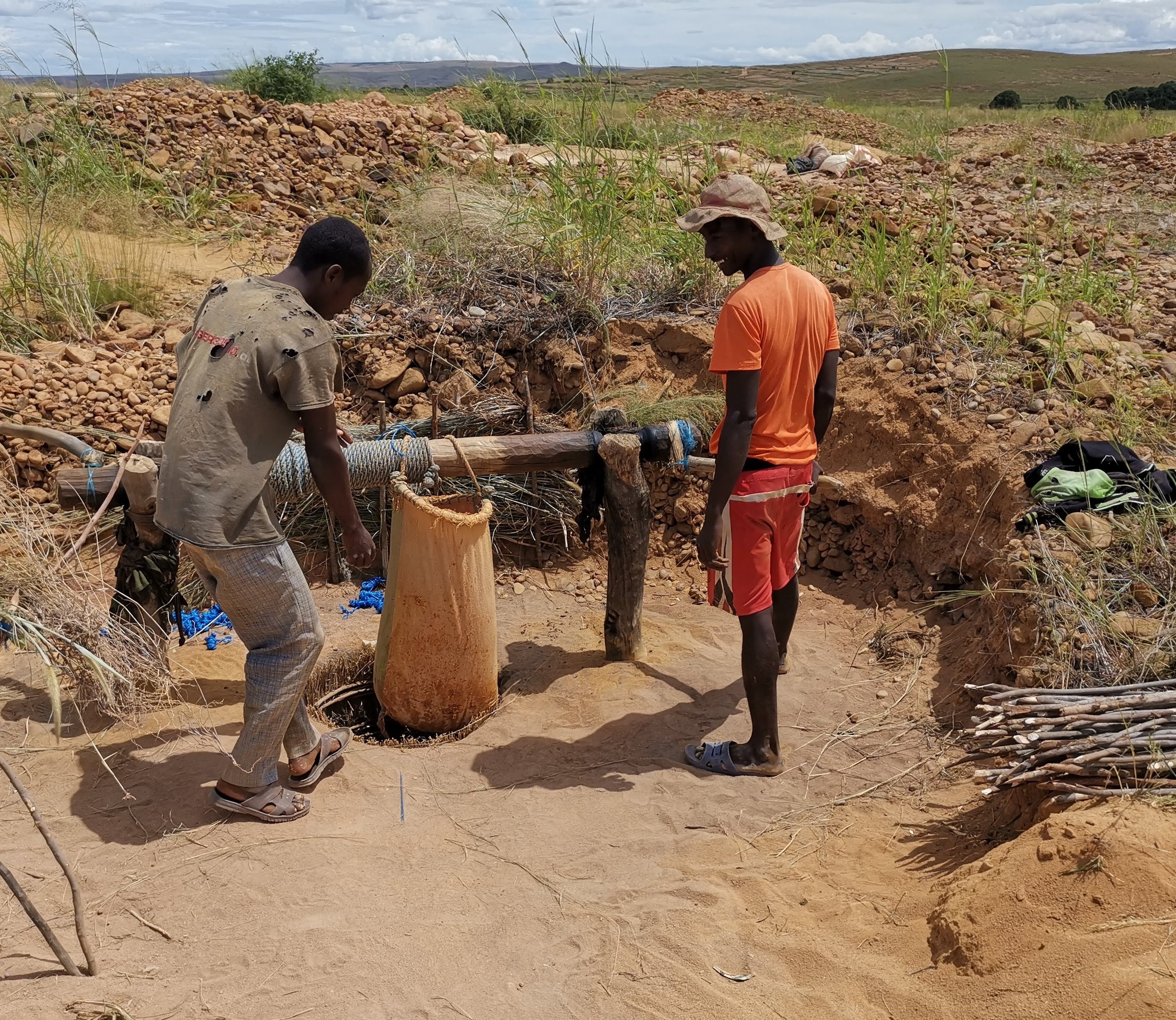gemstone miners use winch to bring stones to surface