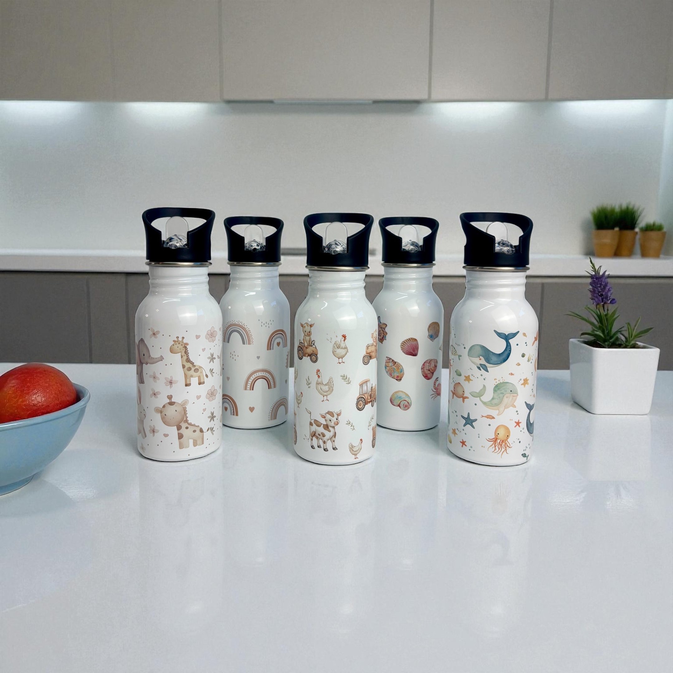 a variety of water bottles with a bowl of fruit