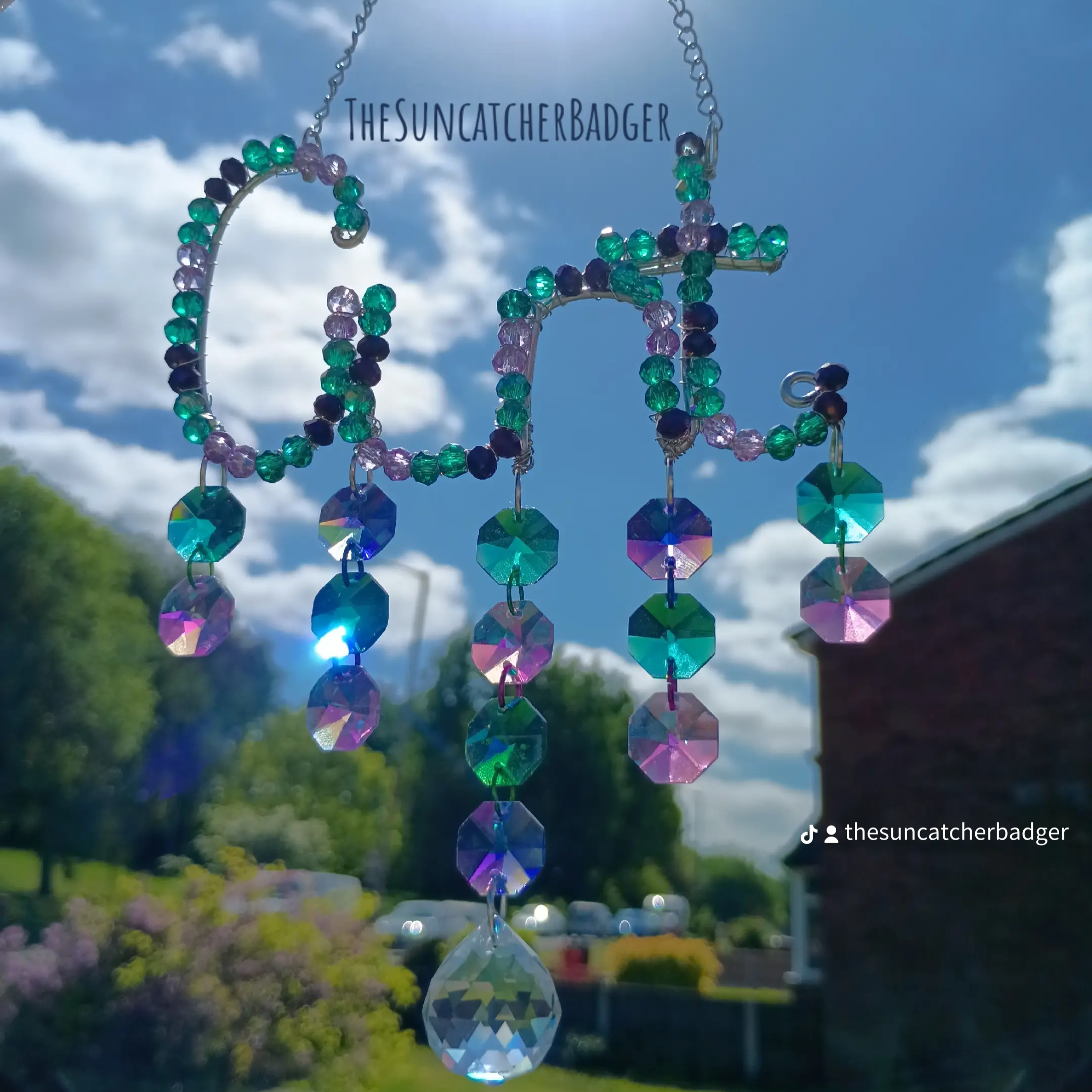 A deep ocean inspired cunt suncatcher called The Sea Witch