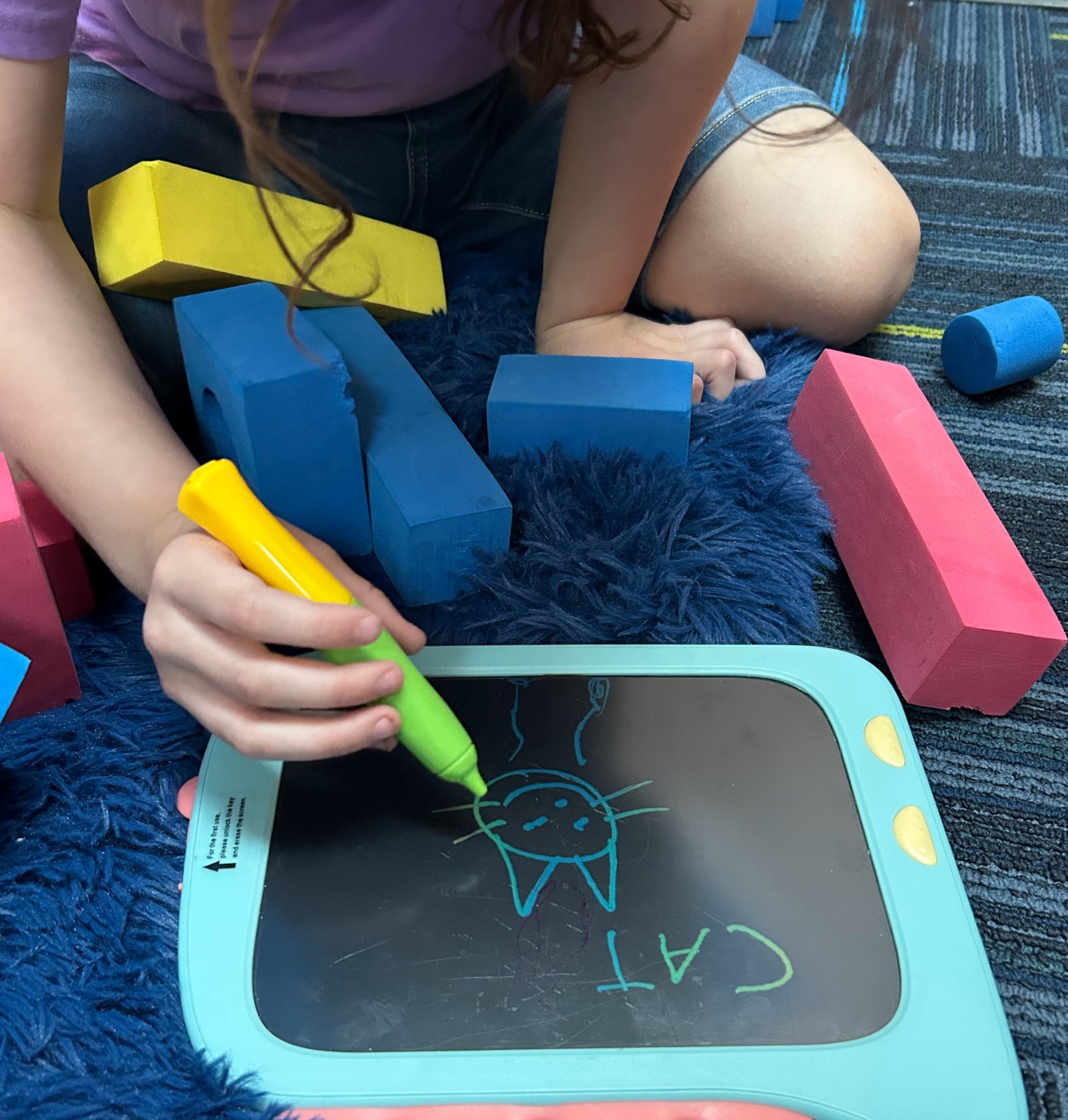 Child working on pencil grip and hand strength during OT in Tempe AZ