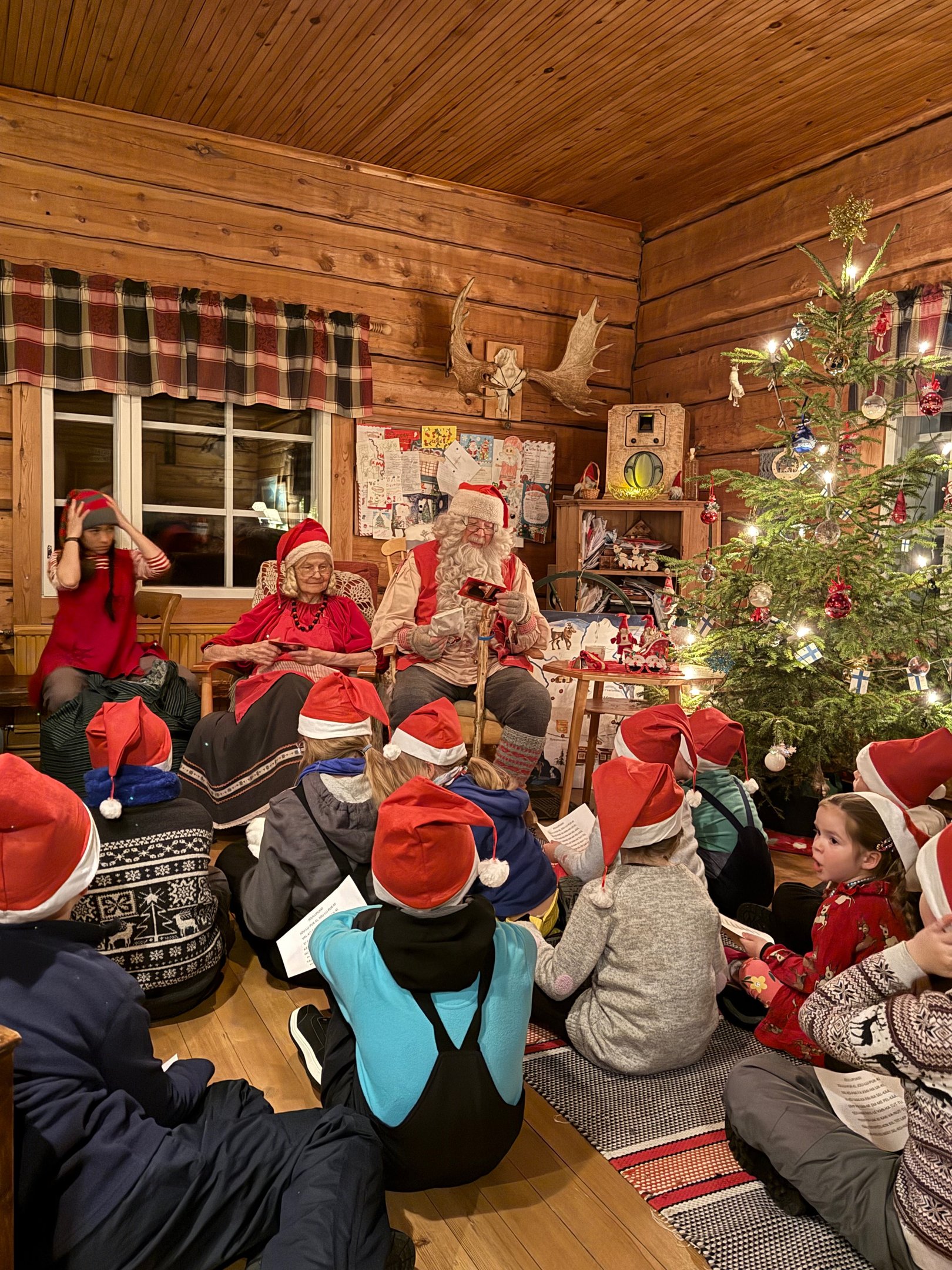 kids with santa in ruka village finland