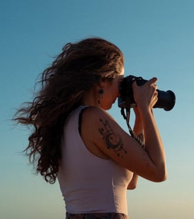 a woman taking a picture with a camera