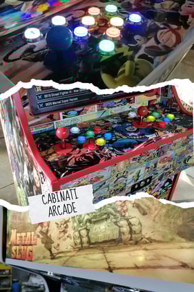 a table top with a bunch of arcade machines