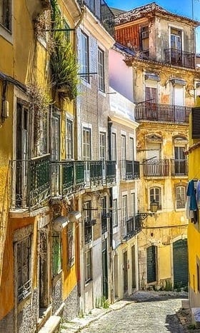 Lisbon - Downtown neighborhood with rows of buildings & cobblestone streets