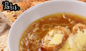 a bowl of onion soup with bread
