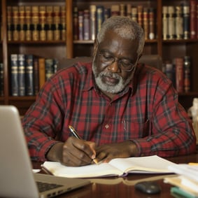 Retired man writing his memoir as his legacy.