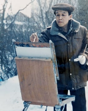 a man in a brown jacket and hat, holding a painting