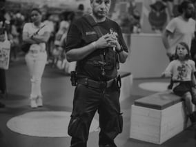 a man in a police uniform is holding a camera