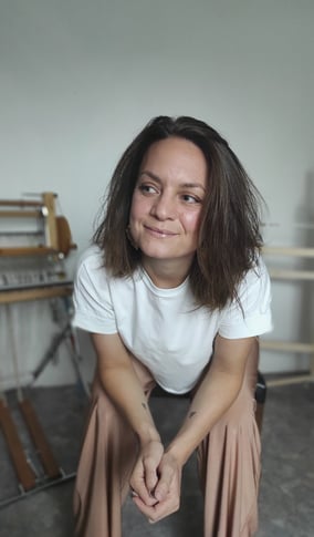 Artist's portrait in her workshop