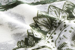 Polyester dino printed fleece fabric swatch