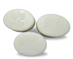 three soap bars with a white soap bar