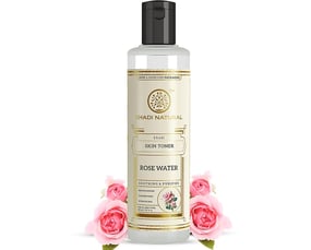 a bottle of water with pink roses and a bottle of water