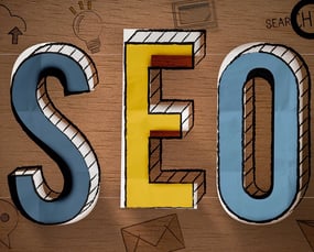 a wooden sign that says seo is a great way to improve your search engine