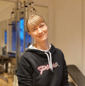 a woman in a black hoodie and a black and white hoodie