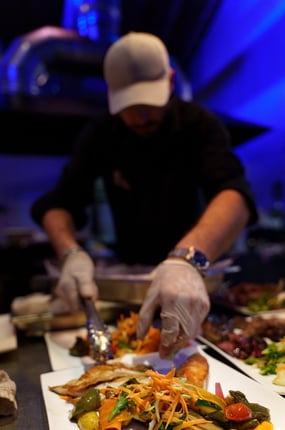 a chef preparing food in a restaurant