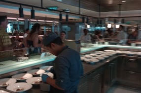 a man is standing in front of a counter top