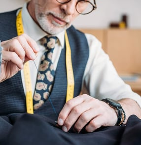 Man using hand sewing needles