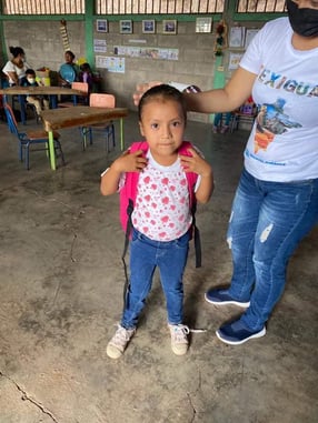 a young girl in a mask mask and a mask on her head