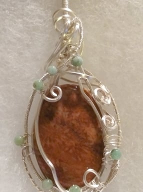 silver wire wrapped orange fossilized coral 