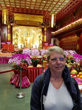 Lady Michelle is happy to be in the Buddha Tooth Relic Temple in Singapore