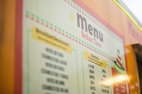 a menu board with a menu on it