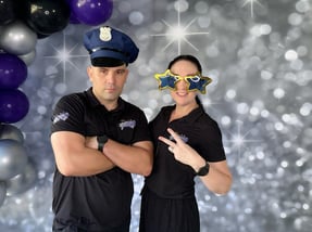 Carly and Kahn from SweetAz Co. posing in the photo booth for Daune's 60th Birthday Party Brisbane.