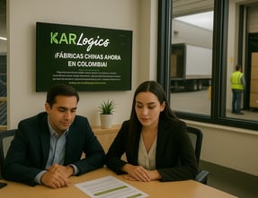 a man and woman sitting at a table with a laptop