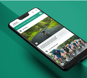 a smartphone phone showing a mobile phone screen displaying a photo of a person riding a bike