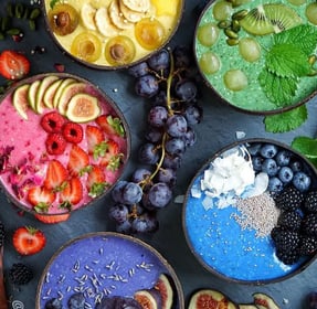 a variety of fruit and vegetables in bowls