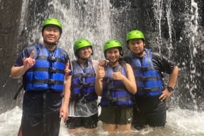 Scenic waterfall along the Ayung River during white water rafting in Ubud, Bali