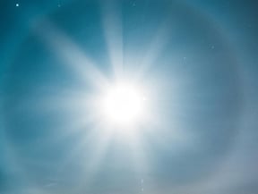 brilliant sun in blue sky