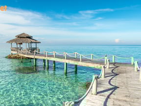 a pier with a thatched hut with a thatched roof in Phuket