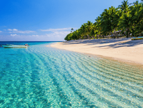 a boat is parked on the beach in Fiji