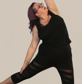 rachel yoga pose black outfit white background