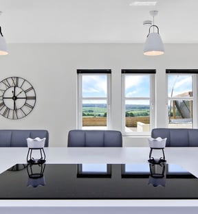 Modern kitchen design with integrated appliances and a spacious island.