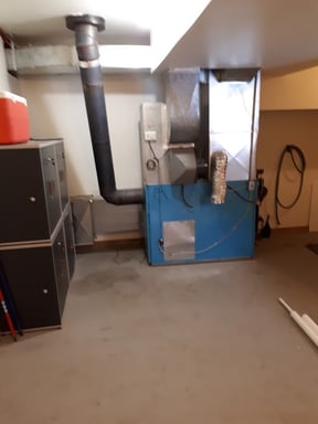 Old furnace removed before new Napoleon installation by Bystrom Industries in Kamloops