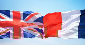 UK and France flags over maritime scene symbolizing international relation