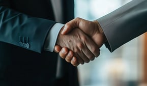 business men shaking hands signaling trust and being legit
