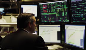 broker looking at investing charts and data