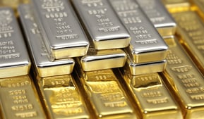 gold and silver bullion bars stacked