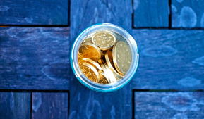 gold coins in glass for gold ira
