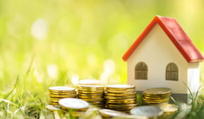 house with coins for real estate investing