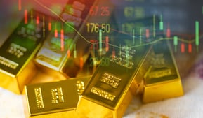 gold bars with investing charts for stock