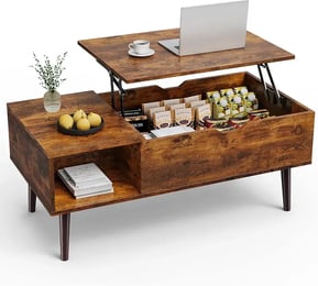 a coffee table with a laptop and a laptop