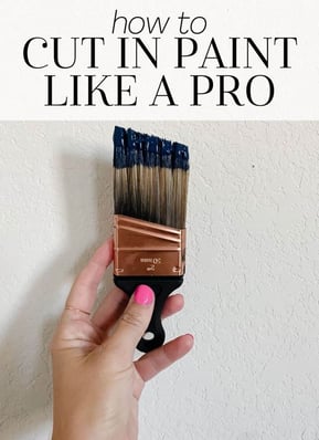 a person holding a brush and a paintbrush with a brush