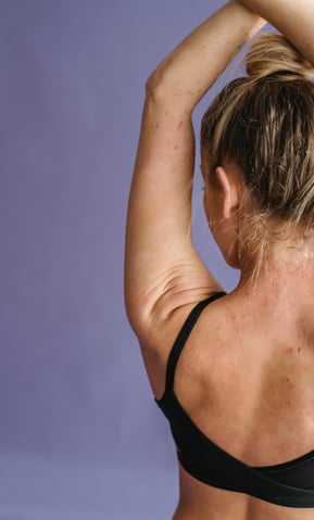 lady with Arms up purple background
